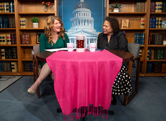 Tasha Boerner sitting at a table with Assemblymember Mia Bonta