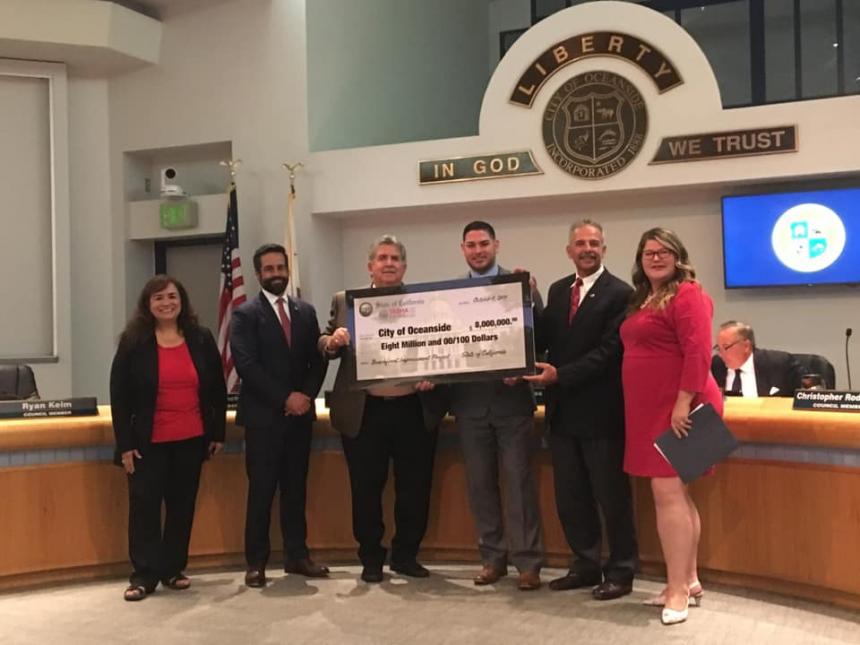 Assemblymember Tasha Boerner Horvath presenting $8 million check to City of Oceanside